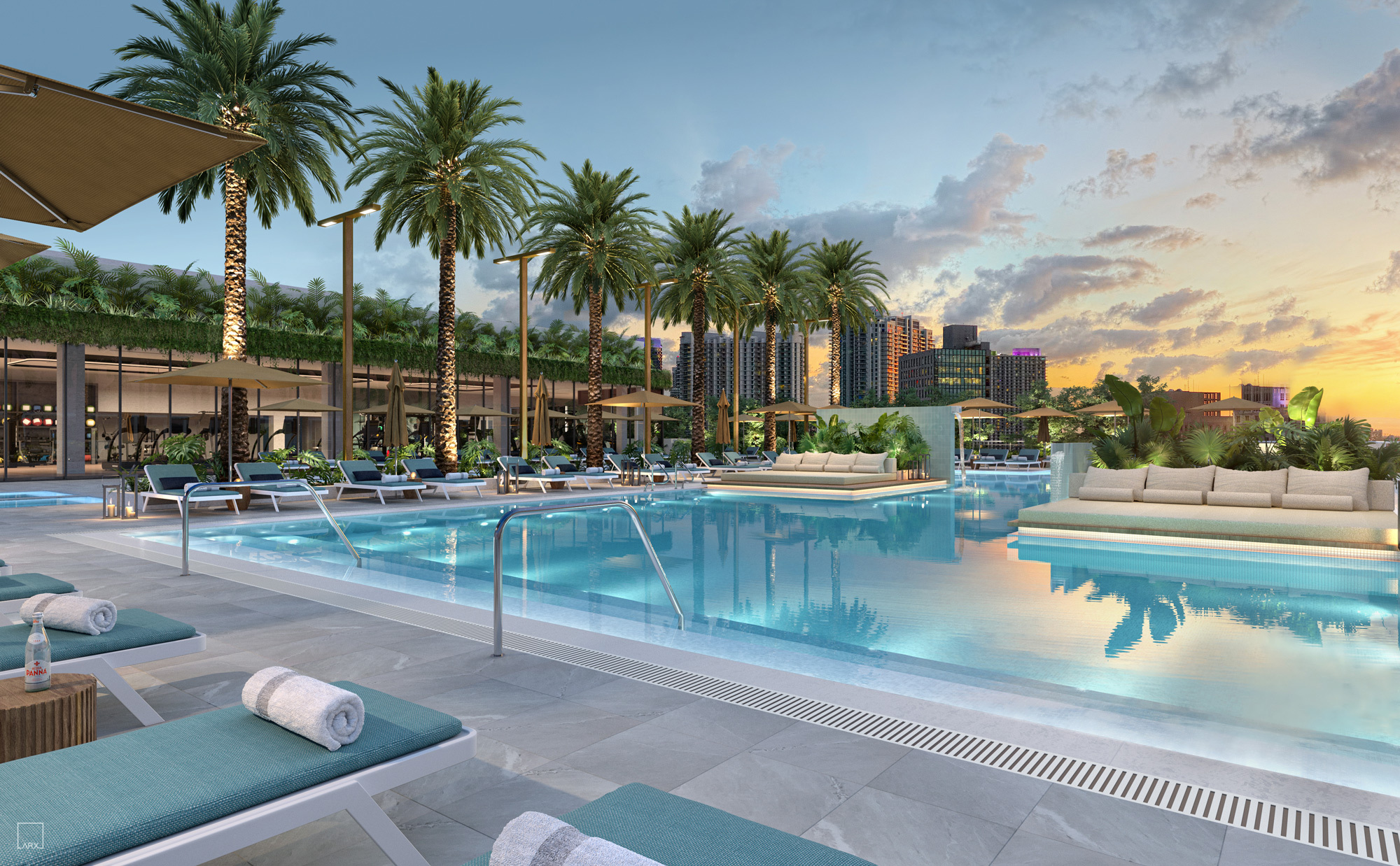Outdoor pool at Forma Miami luxury residences. Large outdoor pool with views of downtown Miami at dusk.