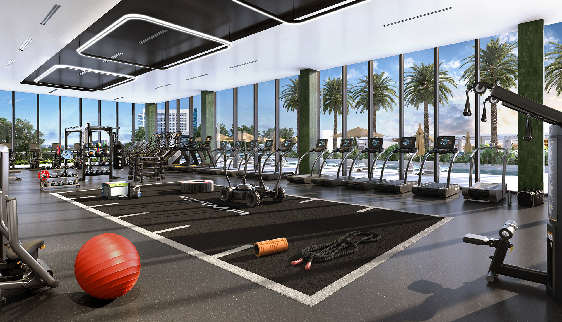 Gym in the fitness center at Forma Miami apartments for lease in midtown Miami. Open workout space with bay views.